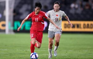 China PR rally to defeat DPR Korea 2–1, top Group C