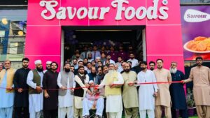 Chaudhry Muhammad Amin Cuts Ribbon at New Savour Foods Branch